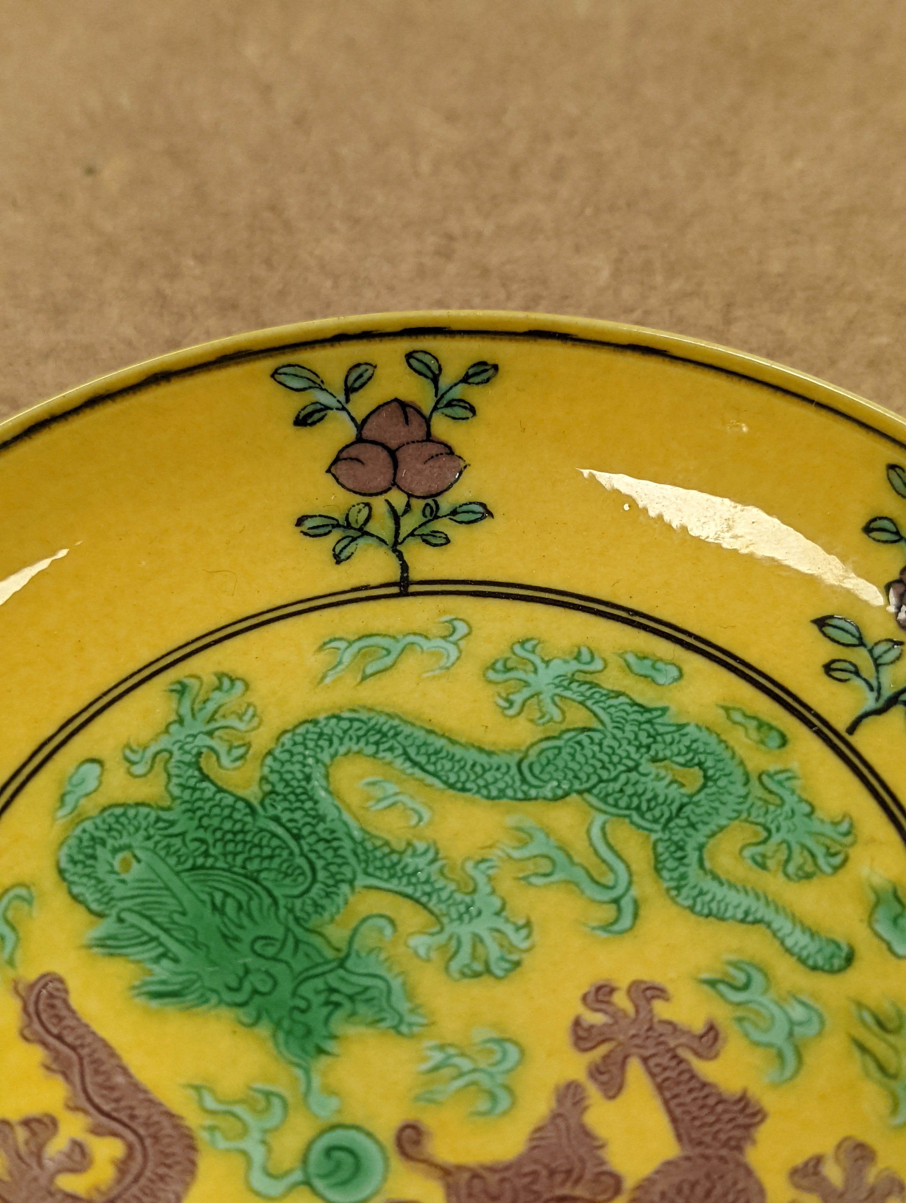 A Chinese yellow ground green and aubergine enamelled 'dragon' dish, Guangxu mark and possibly of the period, D.11cm